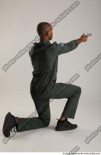 ERIC KNEELING POSE WITH GUNS